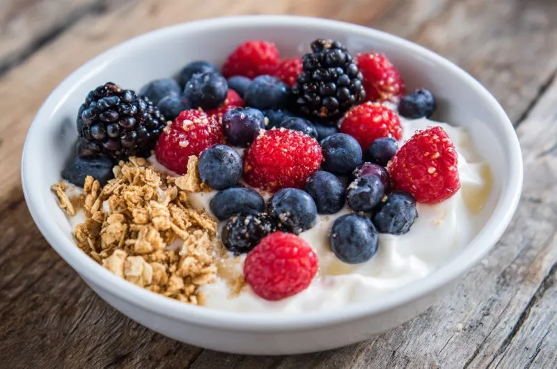 Bowl of probiotic gut-friendly breakfast yogurt and fruits